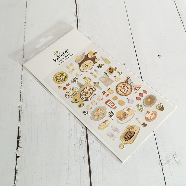 Suatelier Sticker — Food Trip #1 — applied in a journal