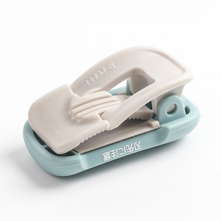 Kokuyo Me Clip-Type Tape Cutter (10-15mm) — Grayish Black — flat lay