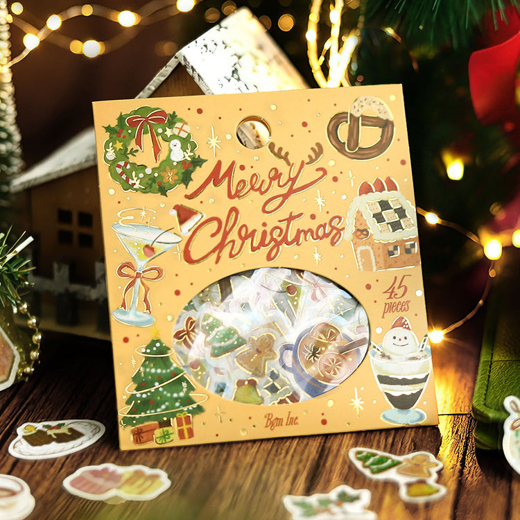BGM Christmas Collection flake seal pack in front of fairy lights and a model snowy house