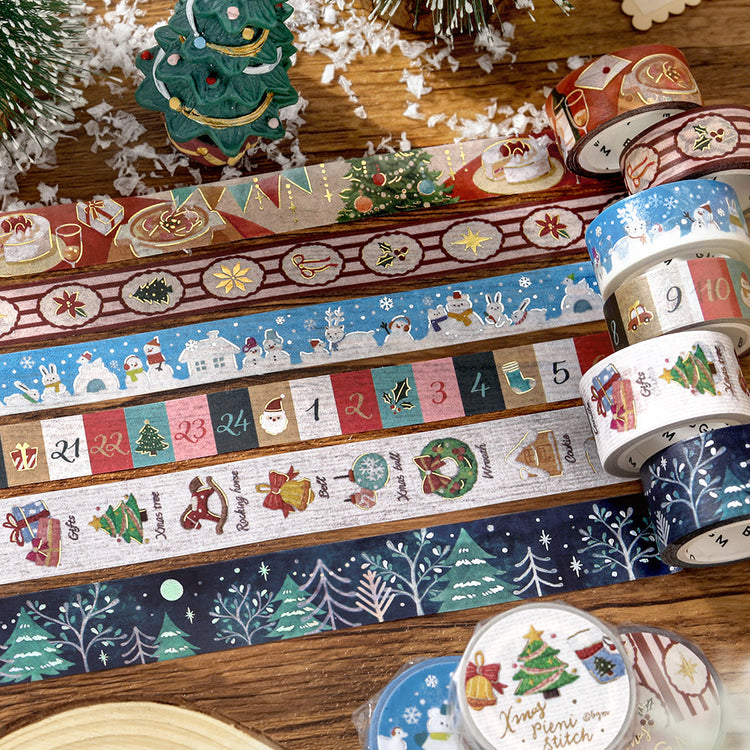 BGM 2026 Christmas Limited washi tape collection on a wooden table, with the Gathering Around the Table tape in the top row
