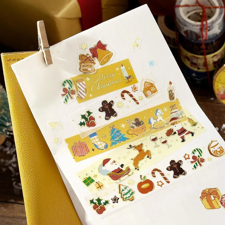 BGM Santa’s Coming Christmas washi tape featuring Santa carrying gifts with gold foil accents.