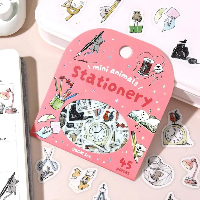 BGM Foil Stamping Flake Seal – Mini Mini Animals: Stationery with 45 washi stickers featuring adorable animals interacting with notebooks, pens, scissors, and other stationery items—enhanced with gold foil accents and a textured finish.