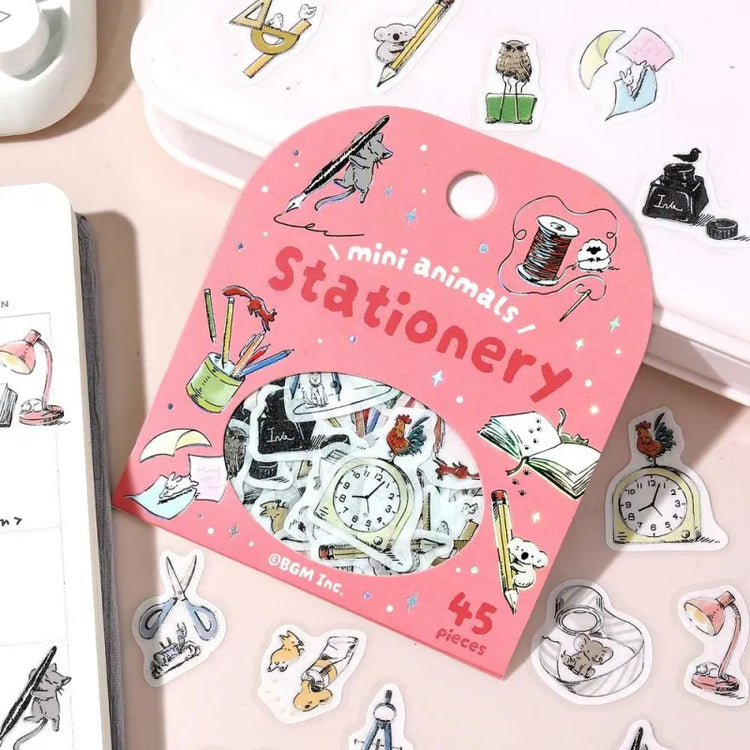 BGM Foil Stamping Flake Seal – Mini Mini Animals: Stationery with 45 washi stickers featuring adorable animals interacting with notebooks, pens, scissors, and other stationery items—enhanced with gold foil accents and a textured finish.