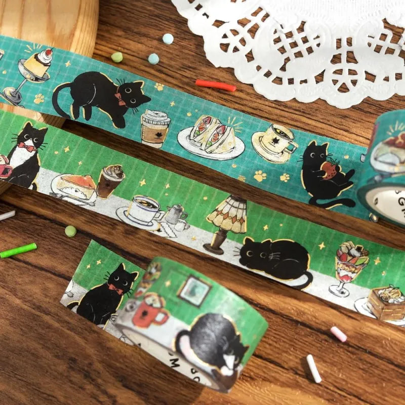 BGM Foil Stamping Masking Tape – Black Cat Café: Café Stroll 20mm washi tape roll featuring black cats with desserts, coffee, and foil paw prints.