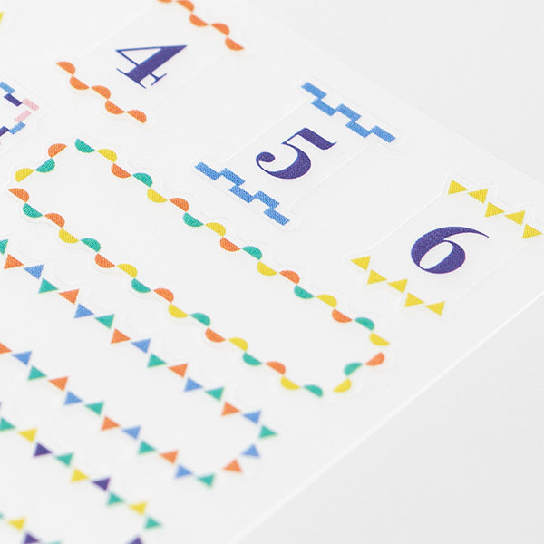 Midori Title Sticker — Color — applied in a journal