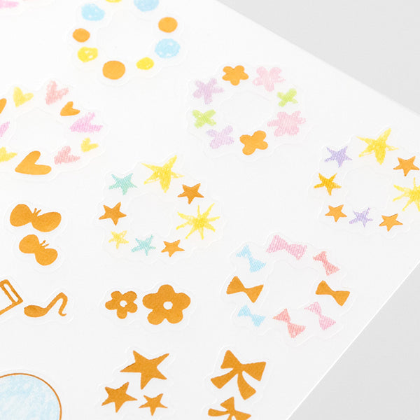 Midori Date Sticker — Twinkling Pastel — applied in a journal