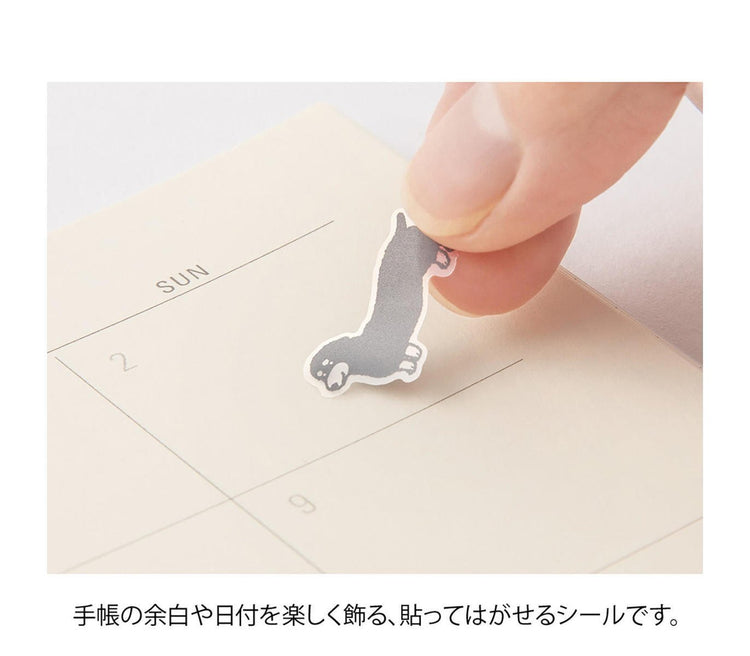 Midori Notebook Sticker — Talking Dogs — applied in a journal